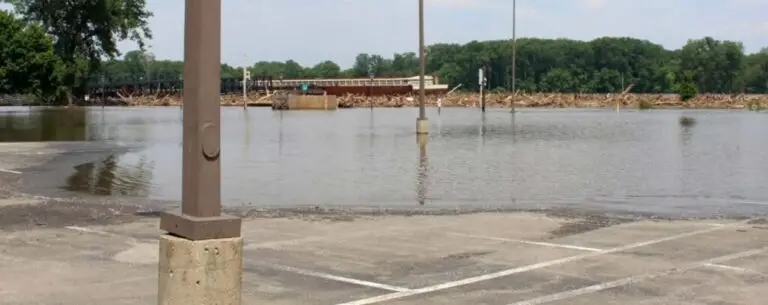 Flooded lots disrupt business and safety. T.G. Basile solves water drainage issues to protect commercial properties year-round