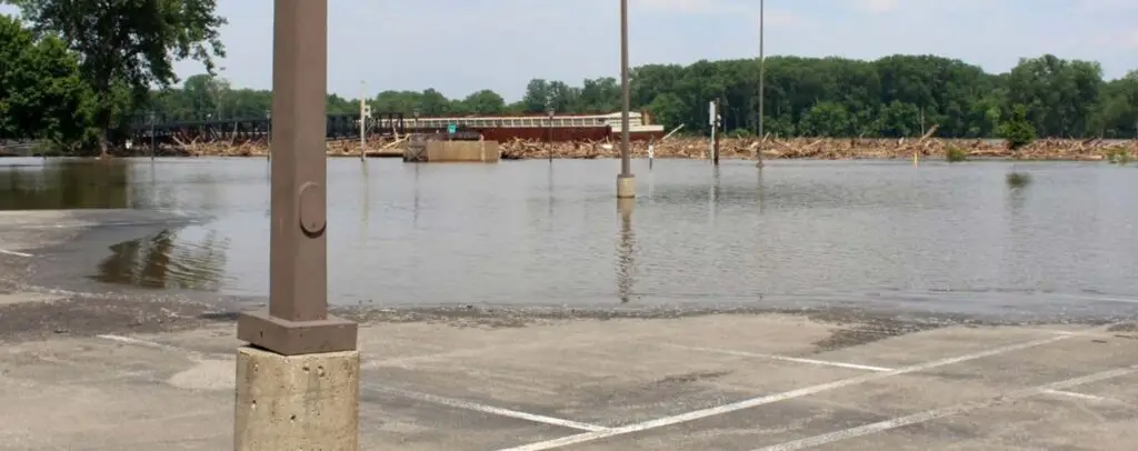 Flooded lots disrupt business and safety. T.G. Basile solves water drainage issues to protect commercial properties year-round