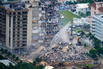 Devastating condo collapse in Florida showing debris, destruction, and rescue teams working at the disaster site