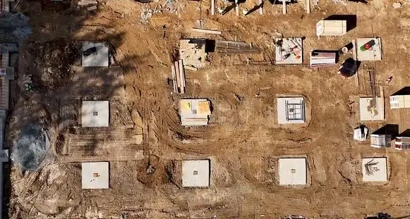 Aerial view shows concrete footings and prep work underway for the ground-up warehouse project in Montville, New Jersey