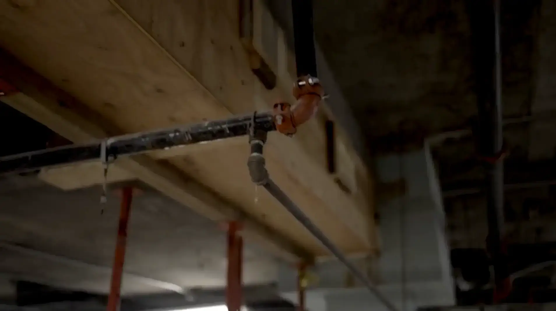 Underground parking garage piping system showing wear and leakage