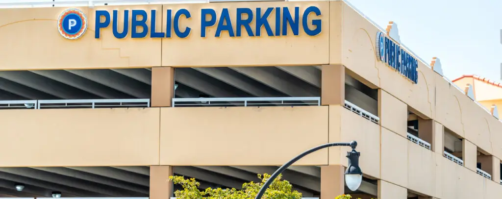 blic parking garage exterior with visible wear, suitable for restoration and maintenance planning