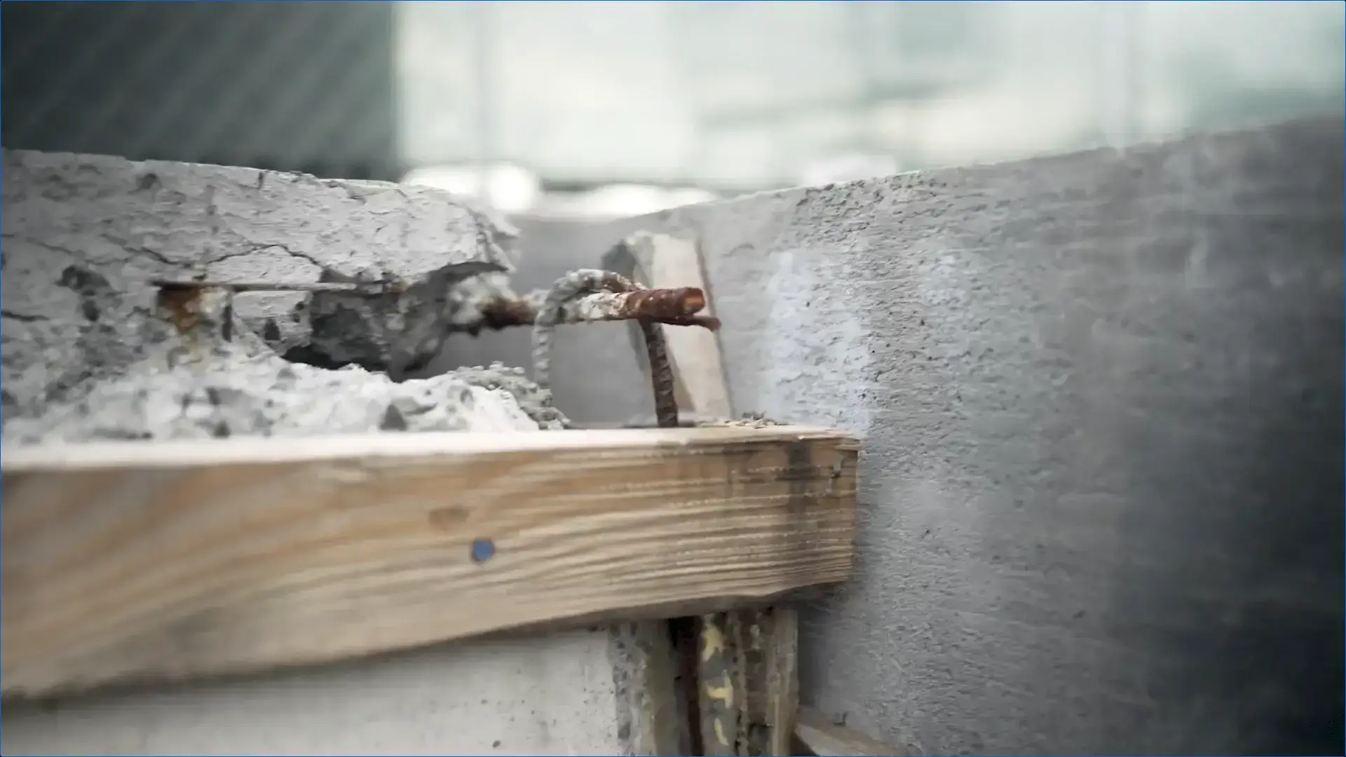 The image shows how moisture and weather conditions cause rebar corrosion and concrete deterioration in a parking structure